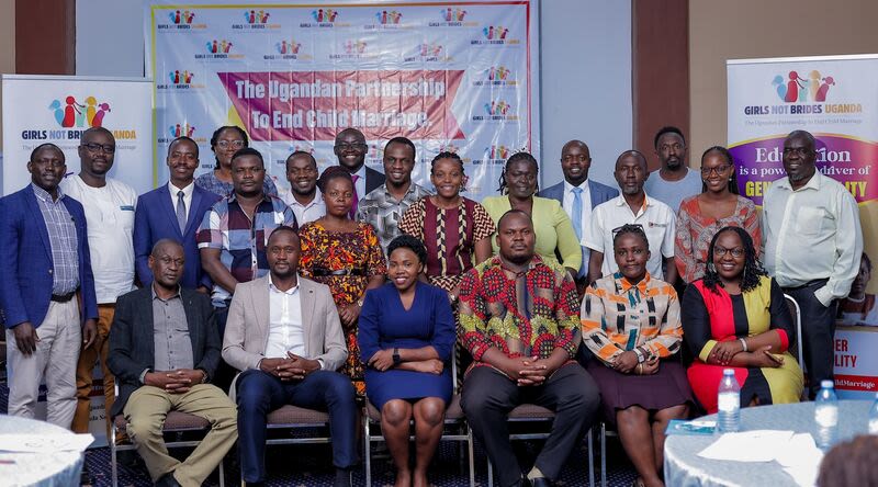 Image of the outgoing and incoming steering committee members for Girls Not Brides Uganda National Partnership, July 2024